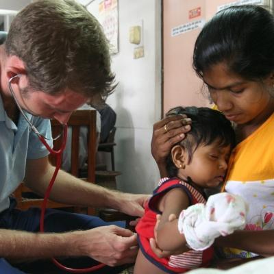 Male Projects Abroad intern pictured conducting a check up on a baby and completing his nursing work experience in Sri Lanka. Male Projects Abroad intern giving a baby a check up whilst on his nursing internship in Sri Lanka where there are lots of nursing internship oppurtunities.